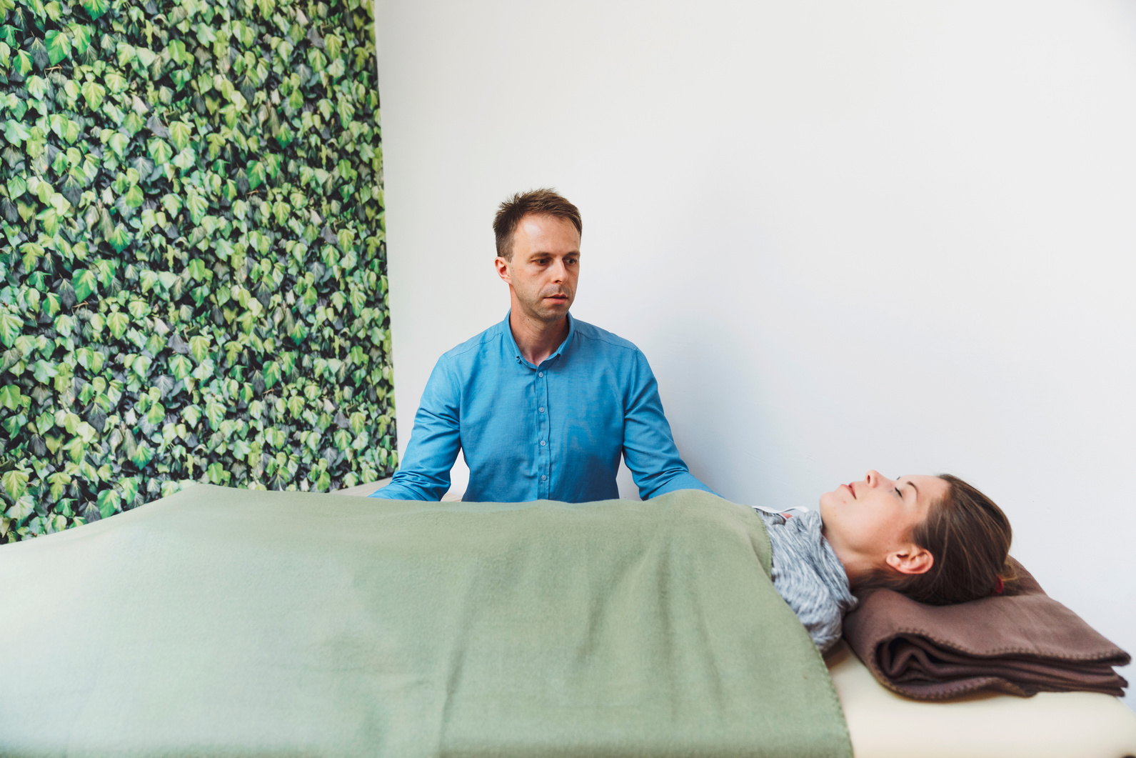 Adult man doing craniosacral therapy